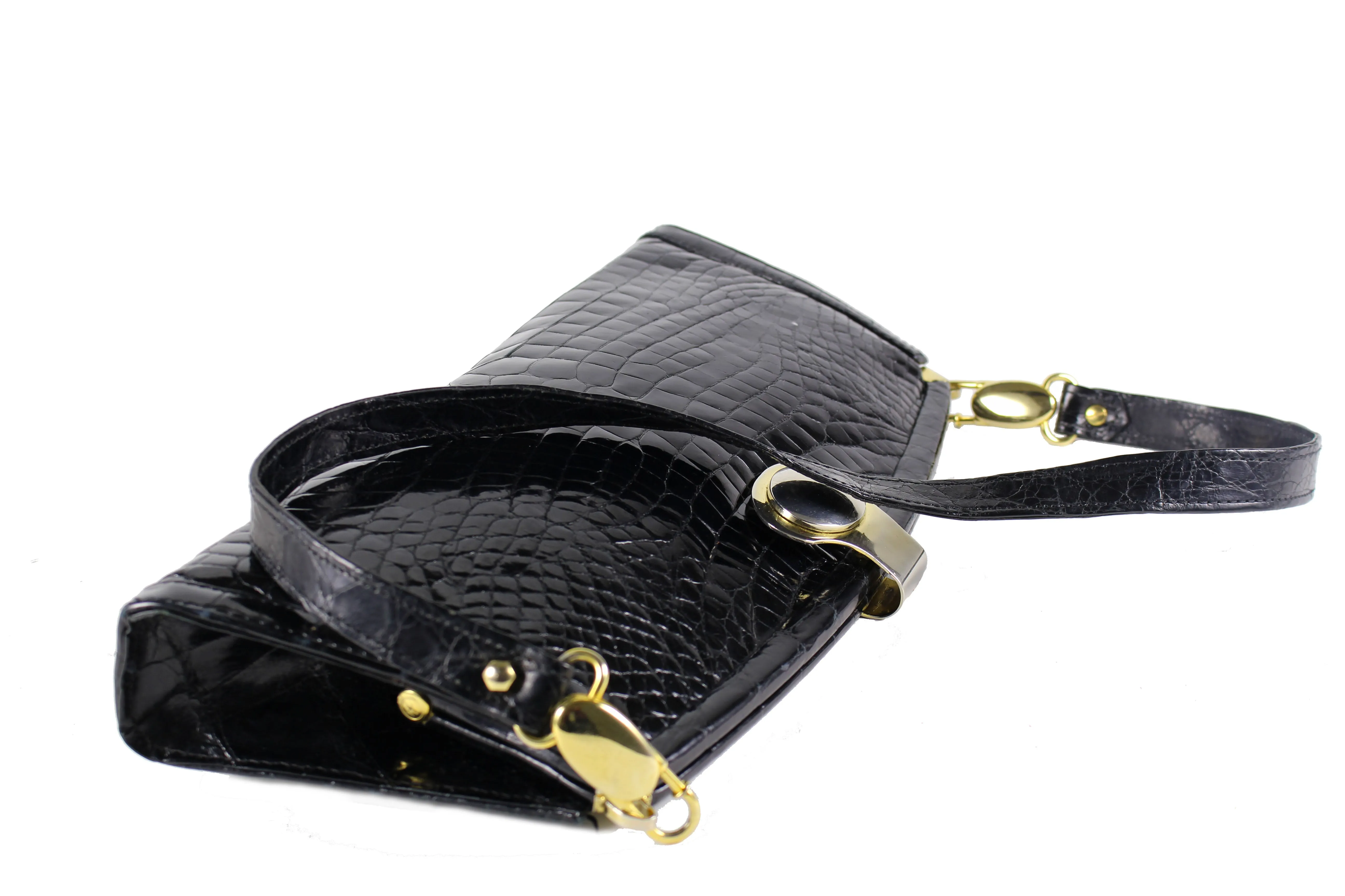 Black crocodile skin clutch with decorative brooch
