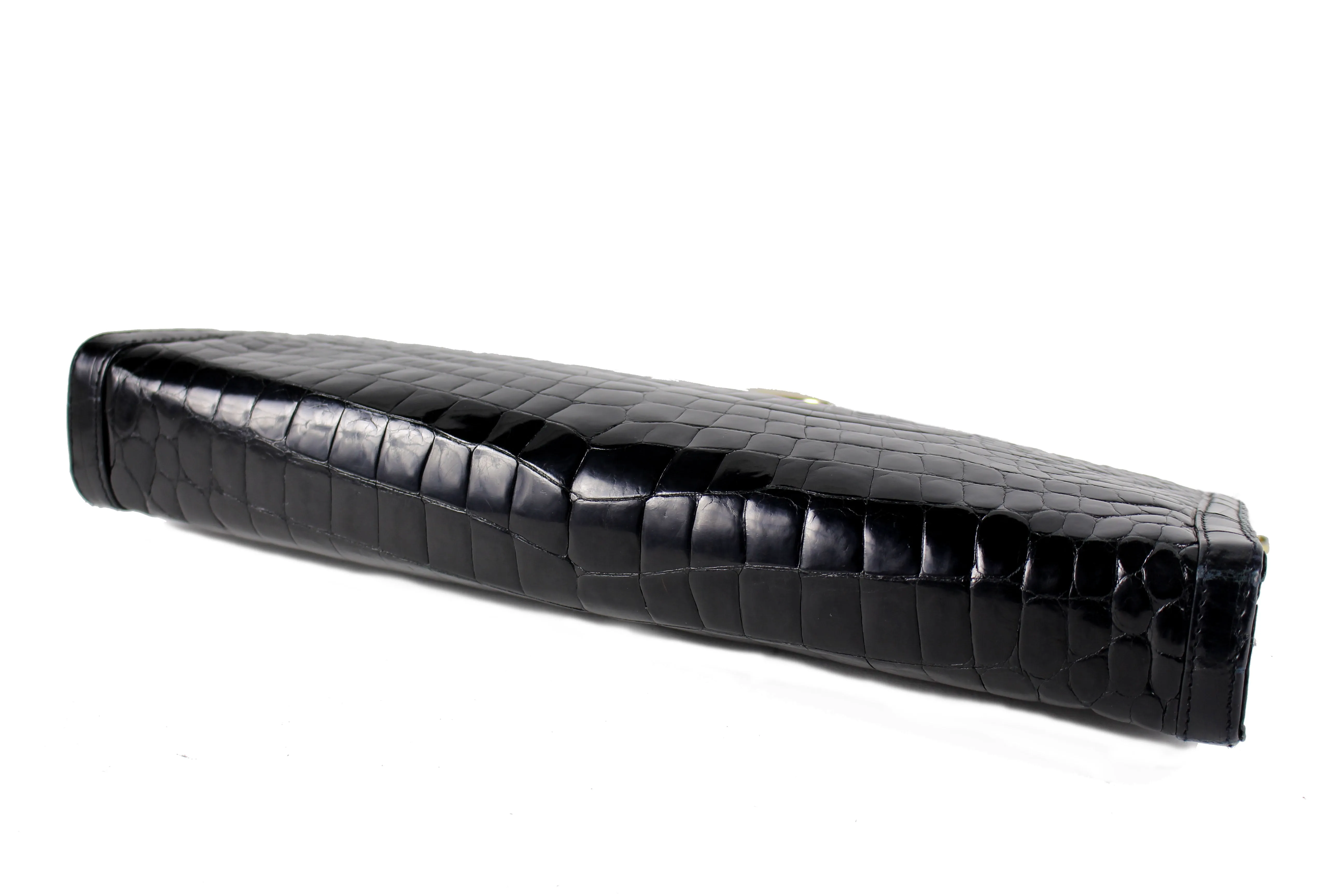 Black crocodile skin clutch with decorative brooch