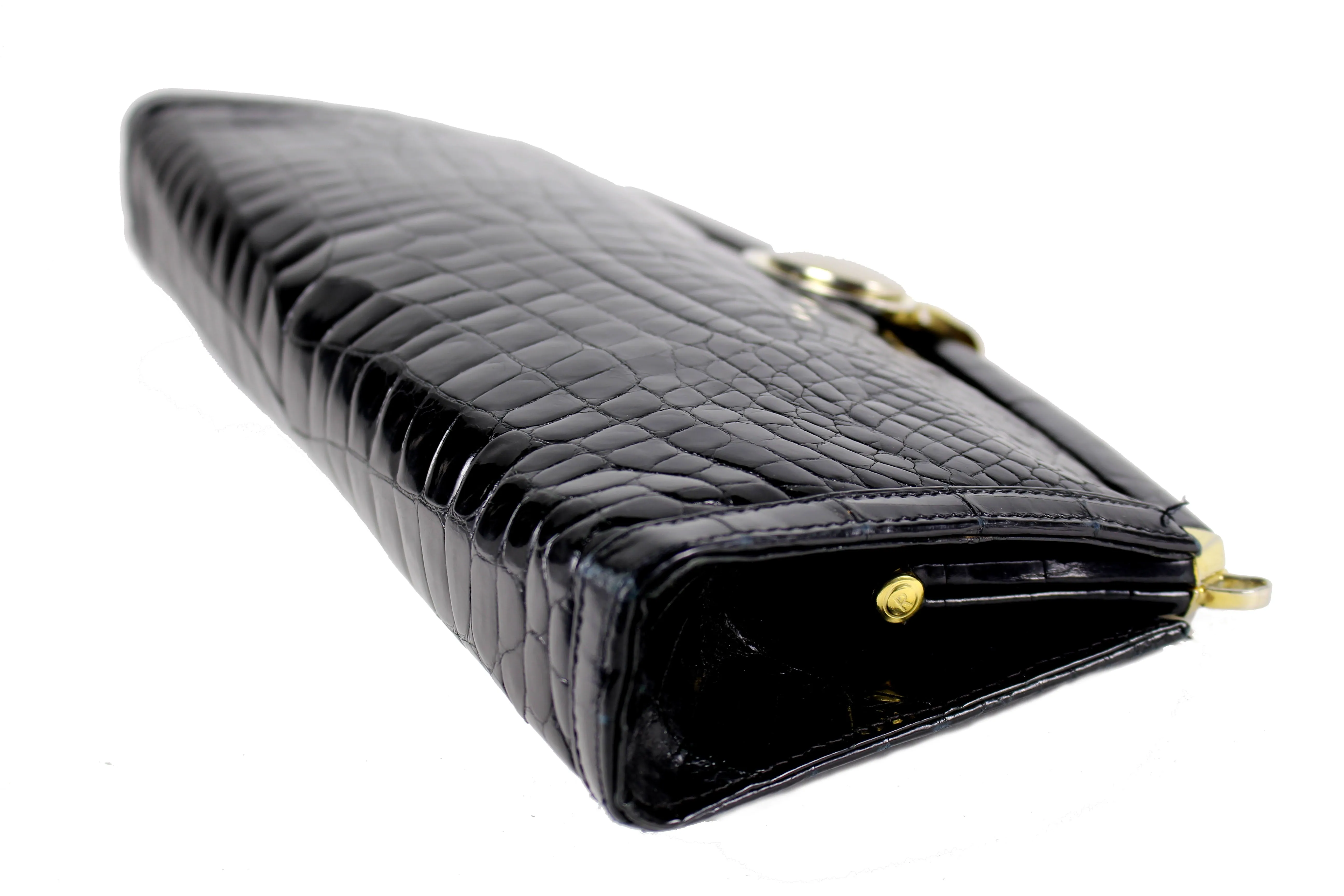 Black crocodile skin clutch with decorative brooch