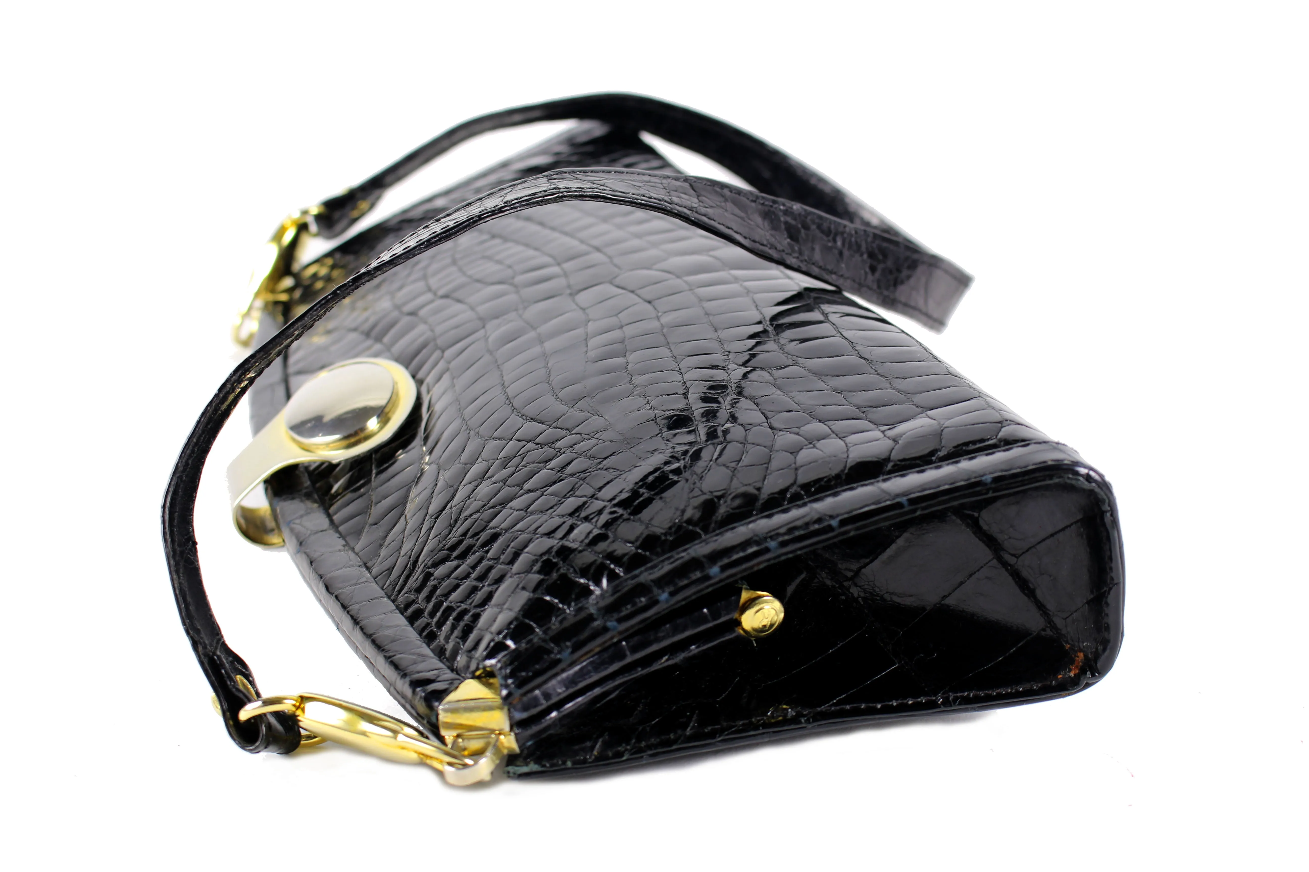 Black crocodile skin clutch with decorative brooch