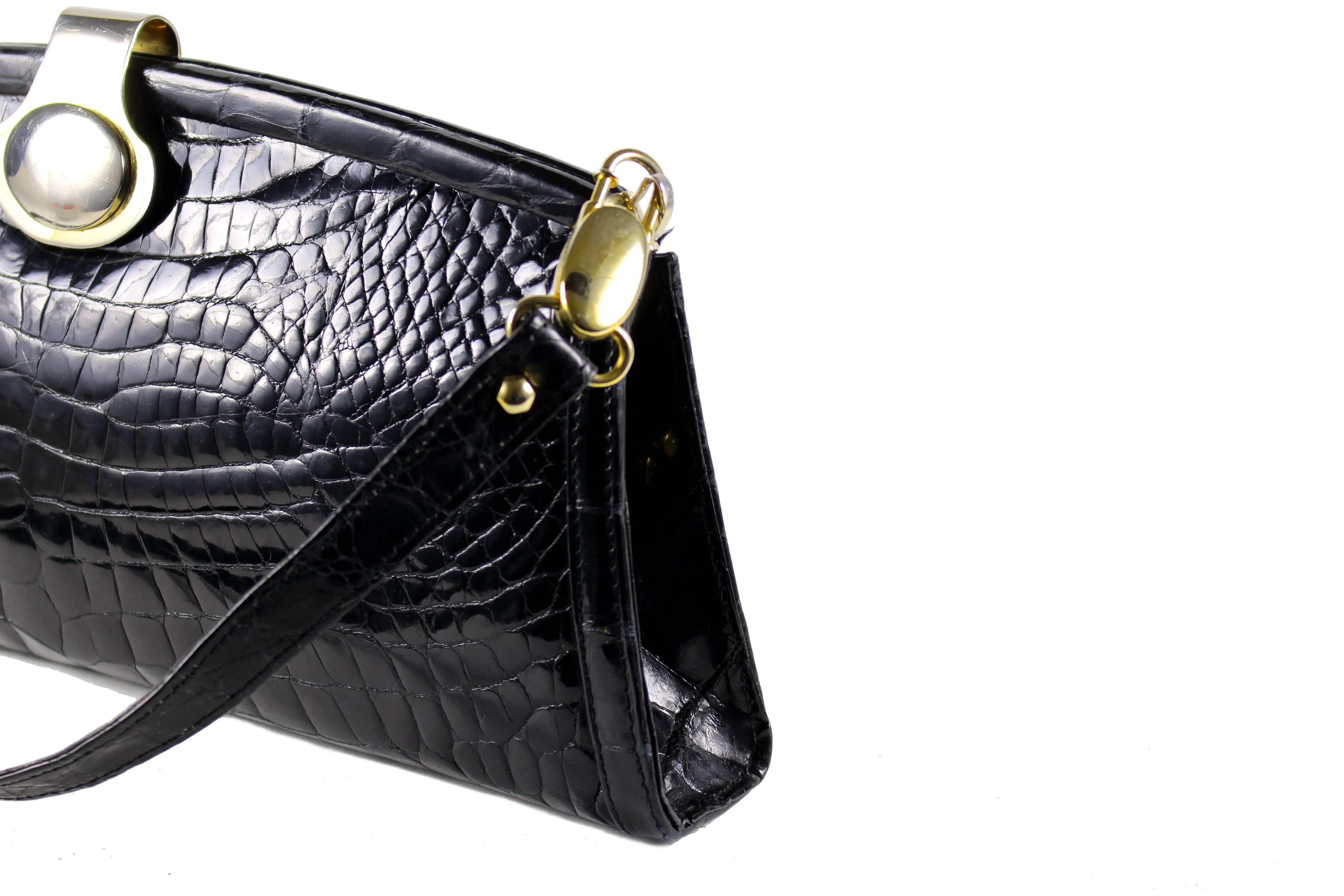 Black crocodile skin clutch with decorative brooch