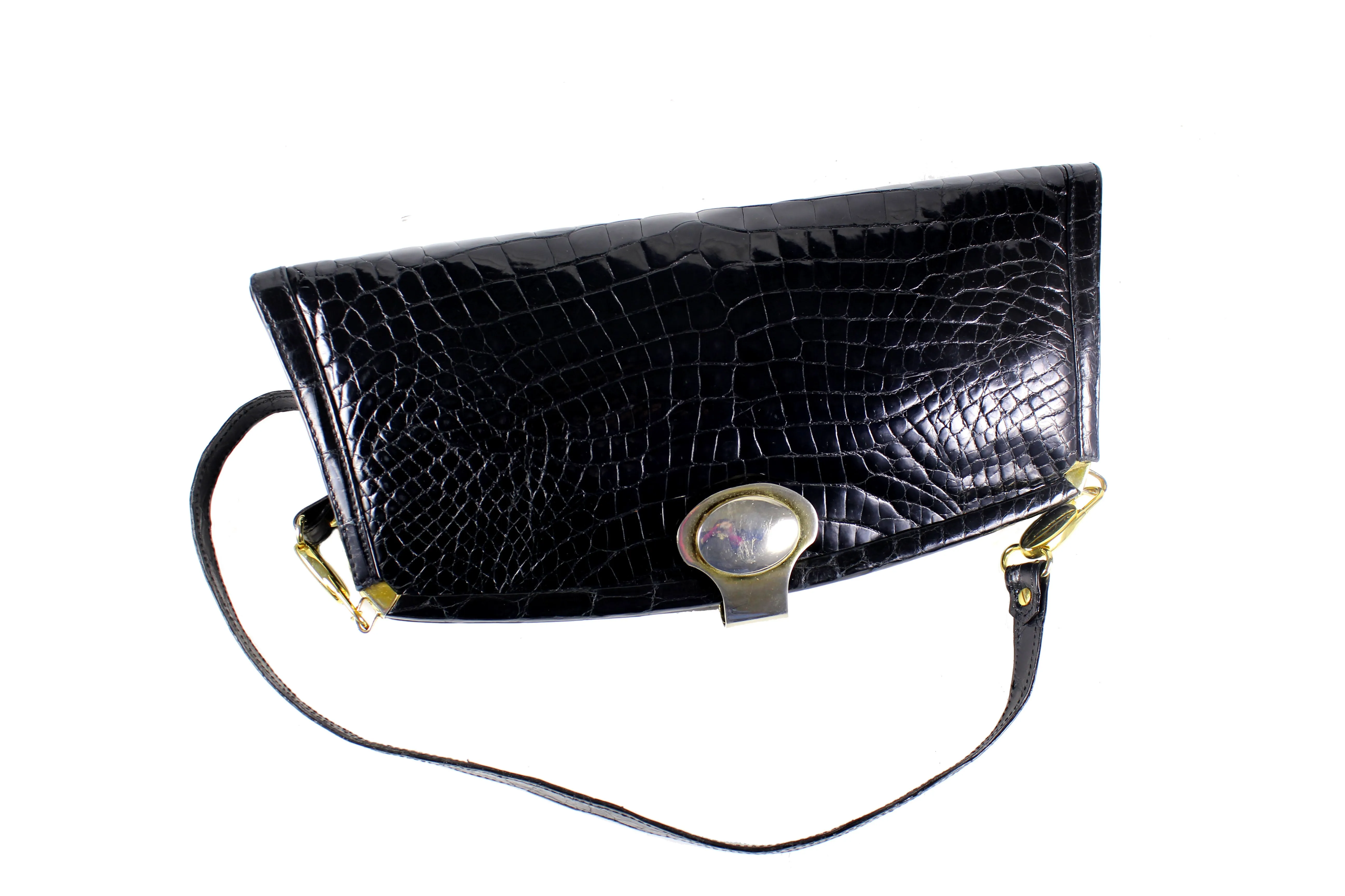 Black crocodile skin clutch with decorative brooch